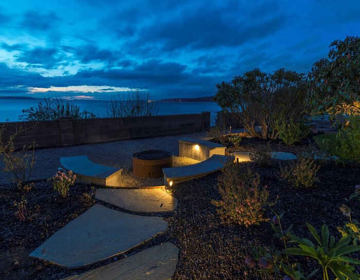 Ballard Residence-bench with coffee table near the sea.