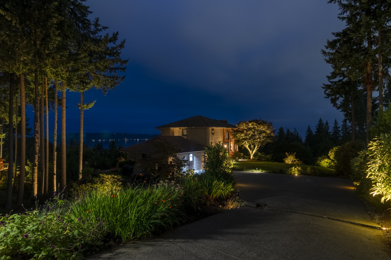 Landscape and driveway lighting guiding arrival circulation at a hilltop estate overlooking Puget Sound in Edmonds, Washington.
