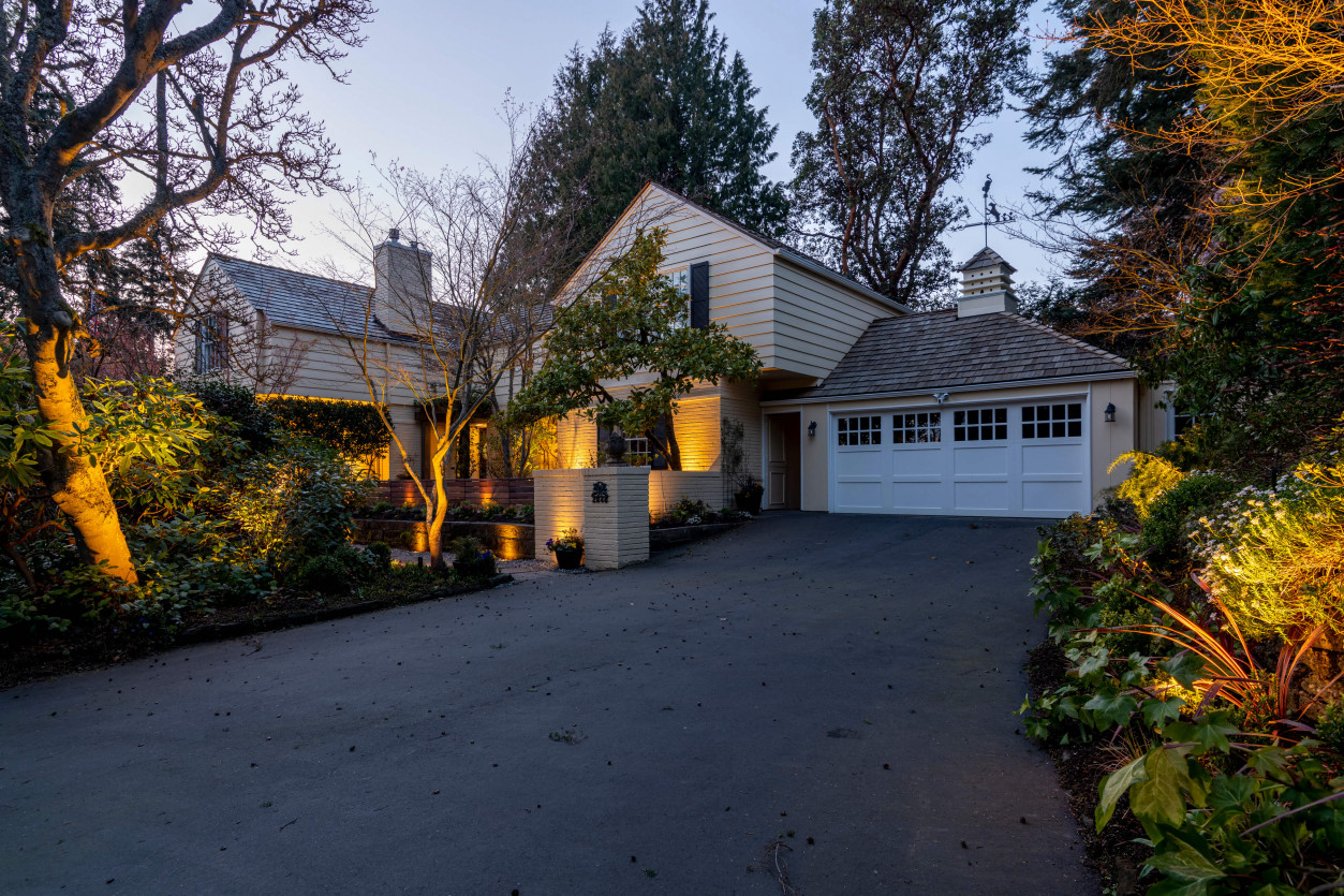 Driveway entrance and garage view illuminated with warm LED lighting in Seattle’s Magnolia neighborhood.